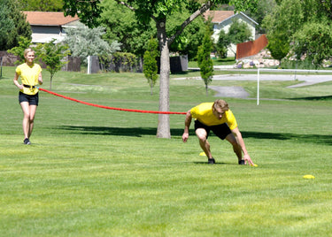 Speed and Agility resistance band bungee for athletic training, used by coaches, football athletic trainers and organizations to build speed and agility in athletes in football, soccer, baseball, softball, basketball, track and field, and all other sports